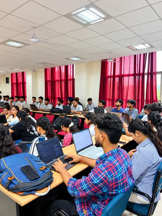 A college batch working on laptops during a techcadd session