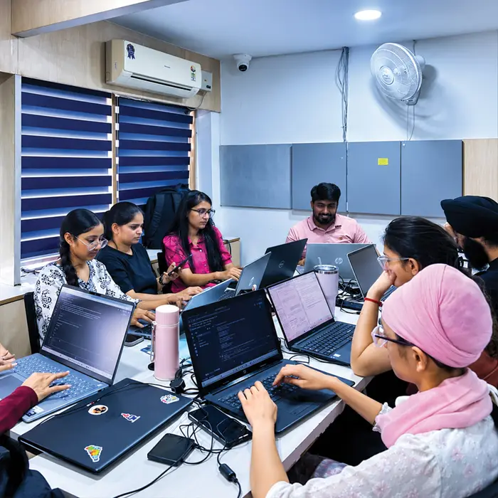 A group working through code together around one table