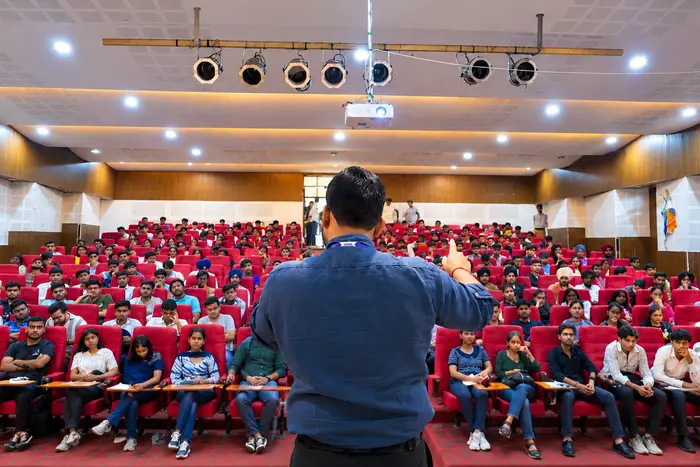 A techcadd speaker taking a full hall through a session