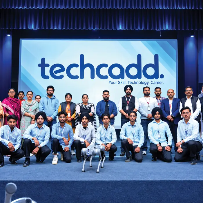 Trainers, staff and students together on stage at a techcadd event
