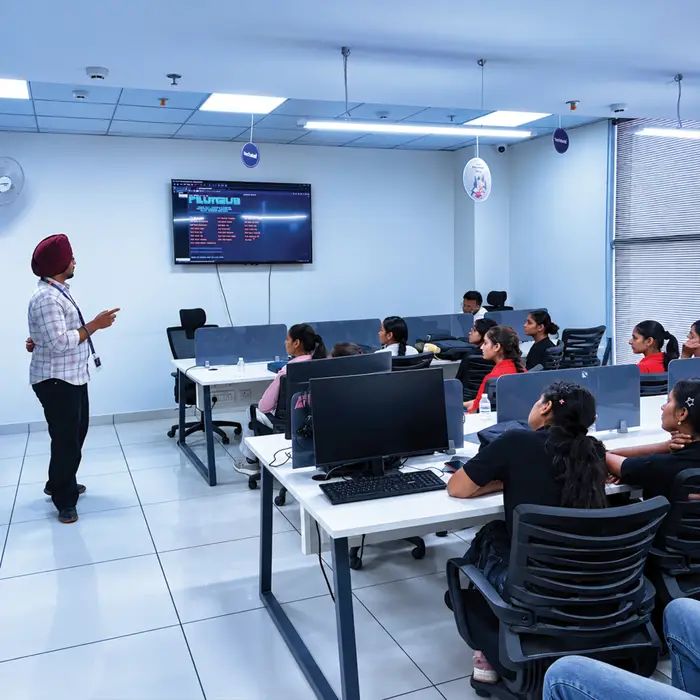 A trainer talking a class through the screen at the front