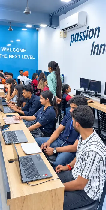 A batch at work under the “Welcome to the next level” wall
